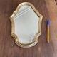 Miroir doré de style Louis XV sobre 32 X 22