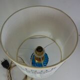 Table lamp with king blue and gold glass foot and machineinor action lampshade