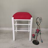 White pine stool with a red seat.
