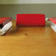 Wall lamp with red swivel shutter