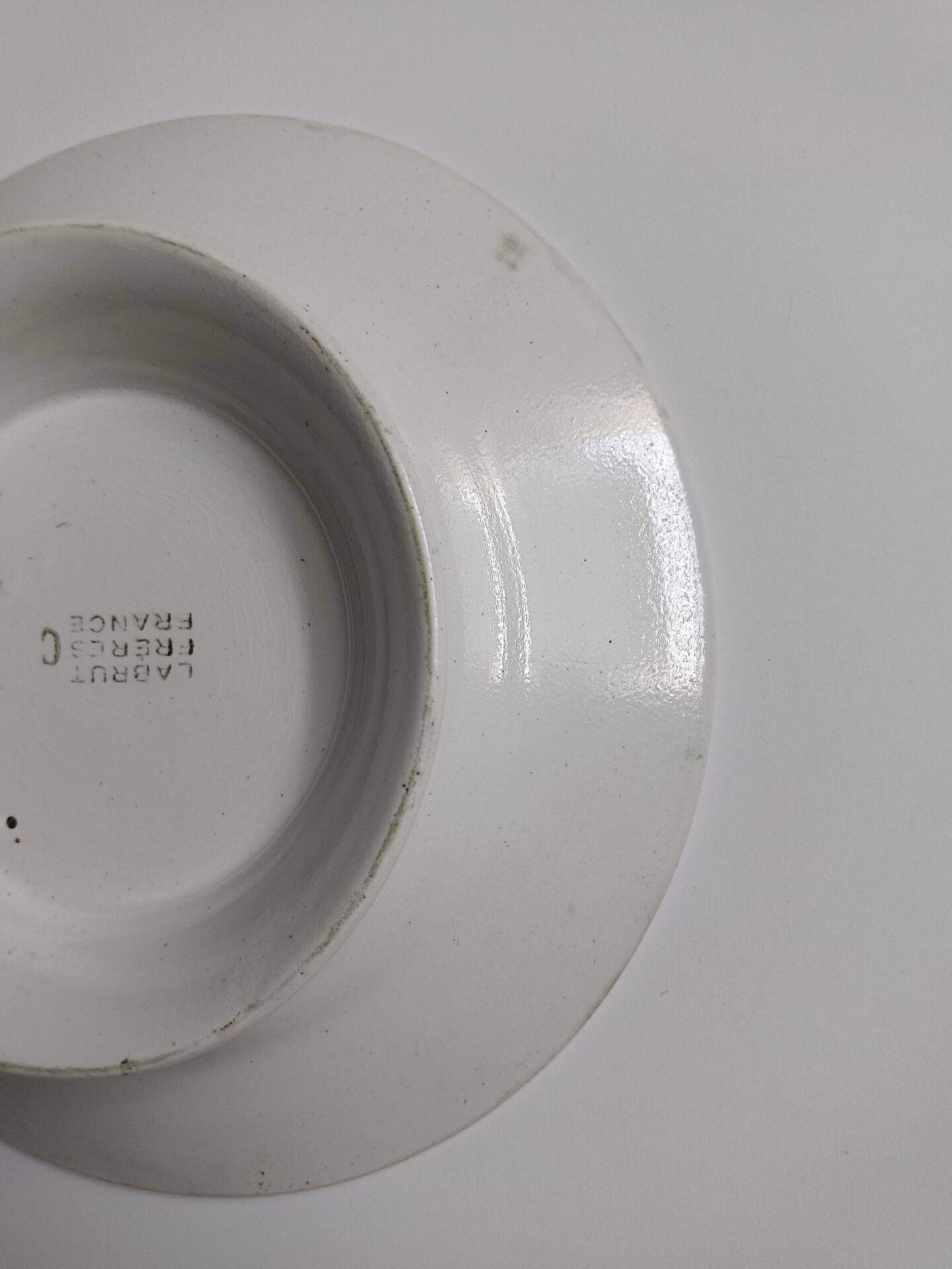 Old round footed plate signed Labrut brothers flowers
