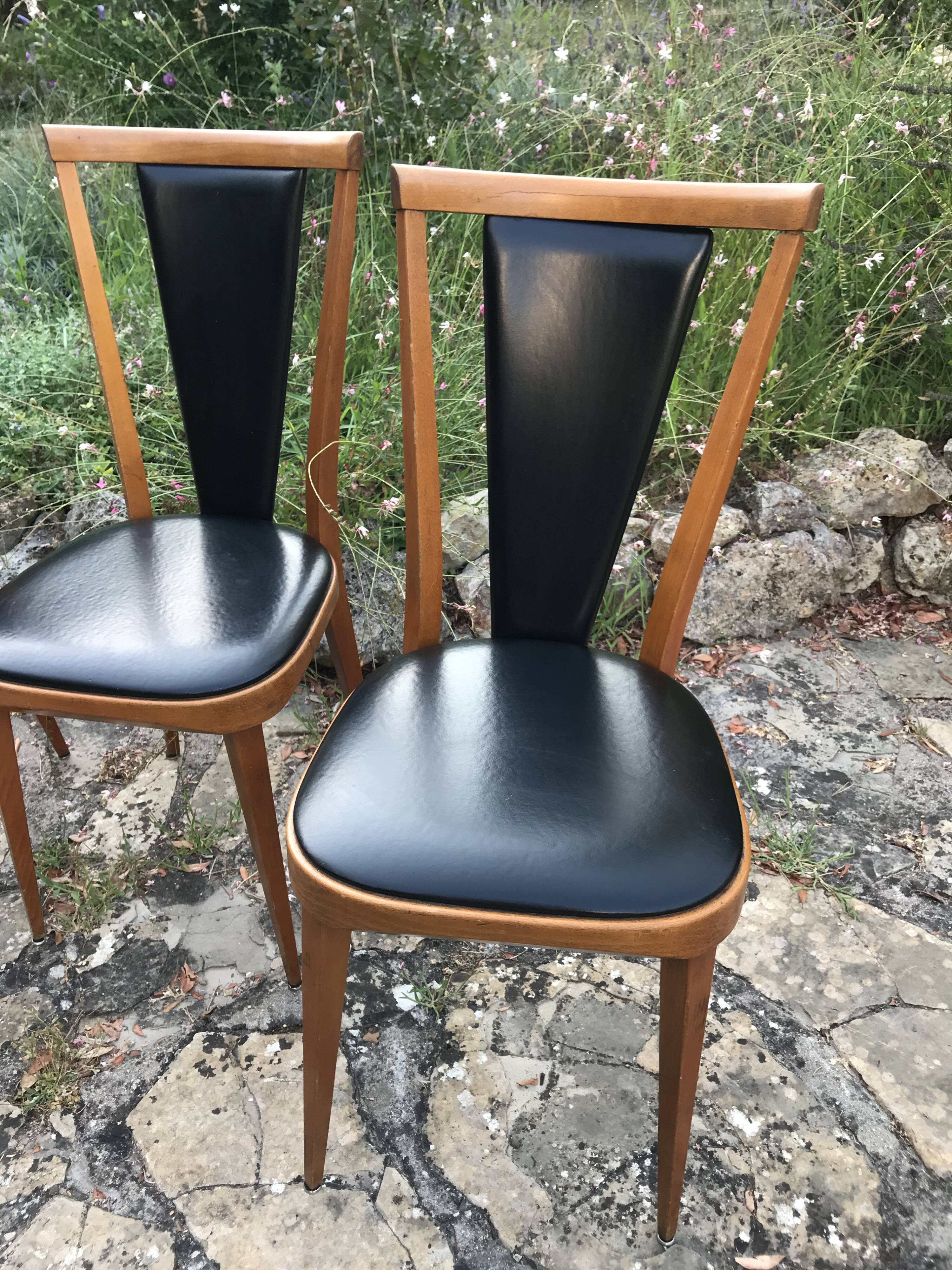 Four vintage beech and skai chairs