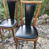 Four vintage beech and skai chairs