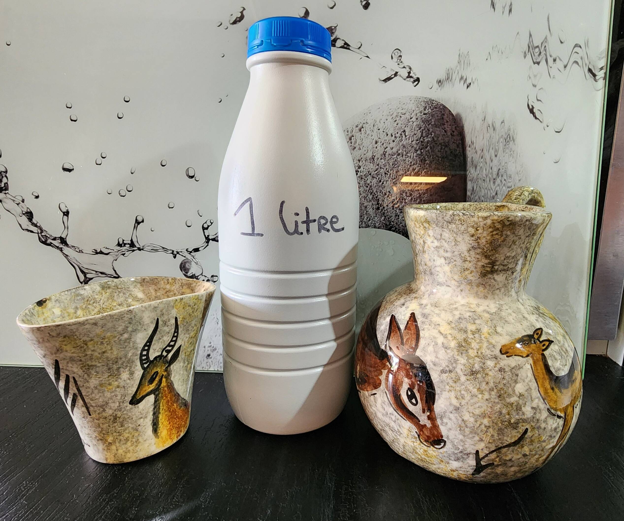 set of jug and ceramic cup handmade decorated with gazelle and deer
