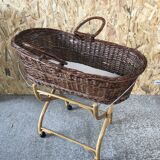 Old woven wicker baby cradle