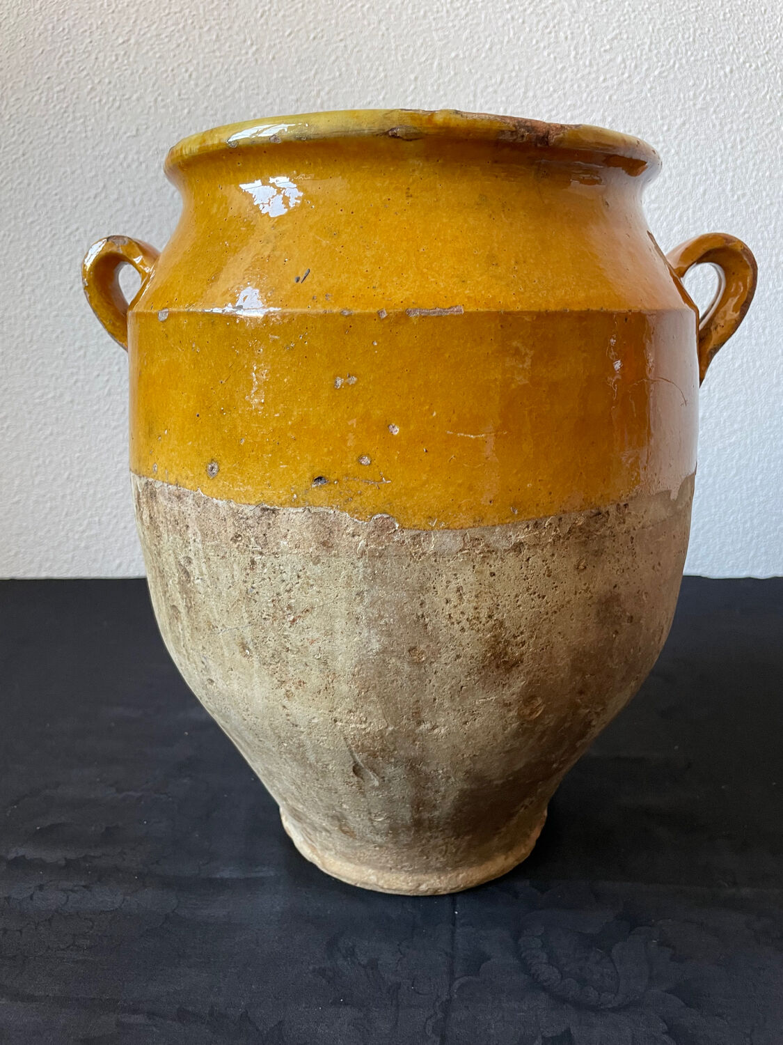 Old yellow glazed terracotta grease pot south west France
