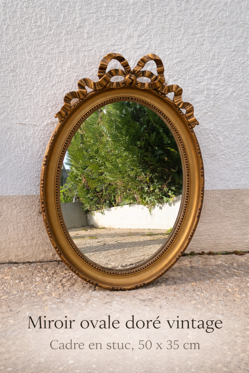 Vintage Louis XVI style oval gold mirror / bow