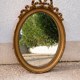 Vintage Louis XVI style oval gold mirror / bow