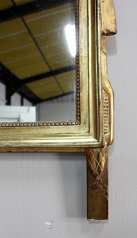 Miroir en bois doré, style Louis XVl, début XXe