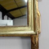 Miroir en bois doré, style Louis XVl, début XXe