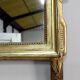 Miroir en bois doré, style Louis XVl, début XXe