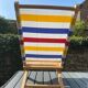 Folding chair in wood and striped fabric