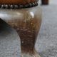 Old wingback armchair made of sheep leather in a correct condition
