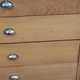 Vintage store chest of drawers in blond oak metal tube legs 4 drawers