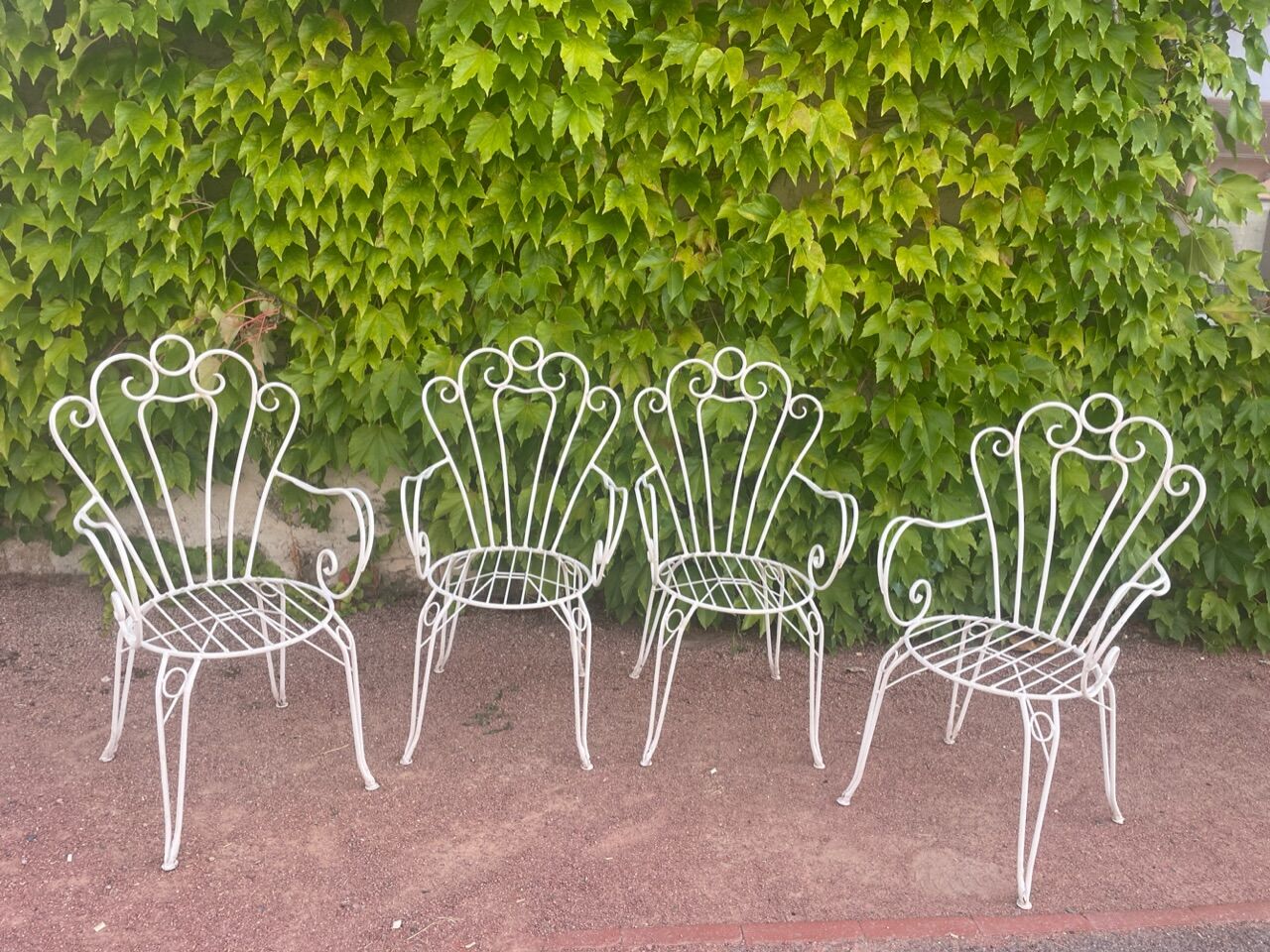 Provençal wrought iron armchairs