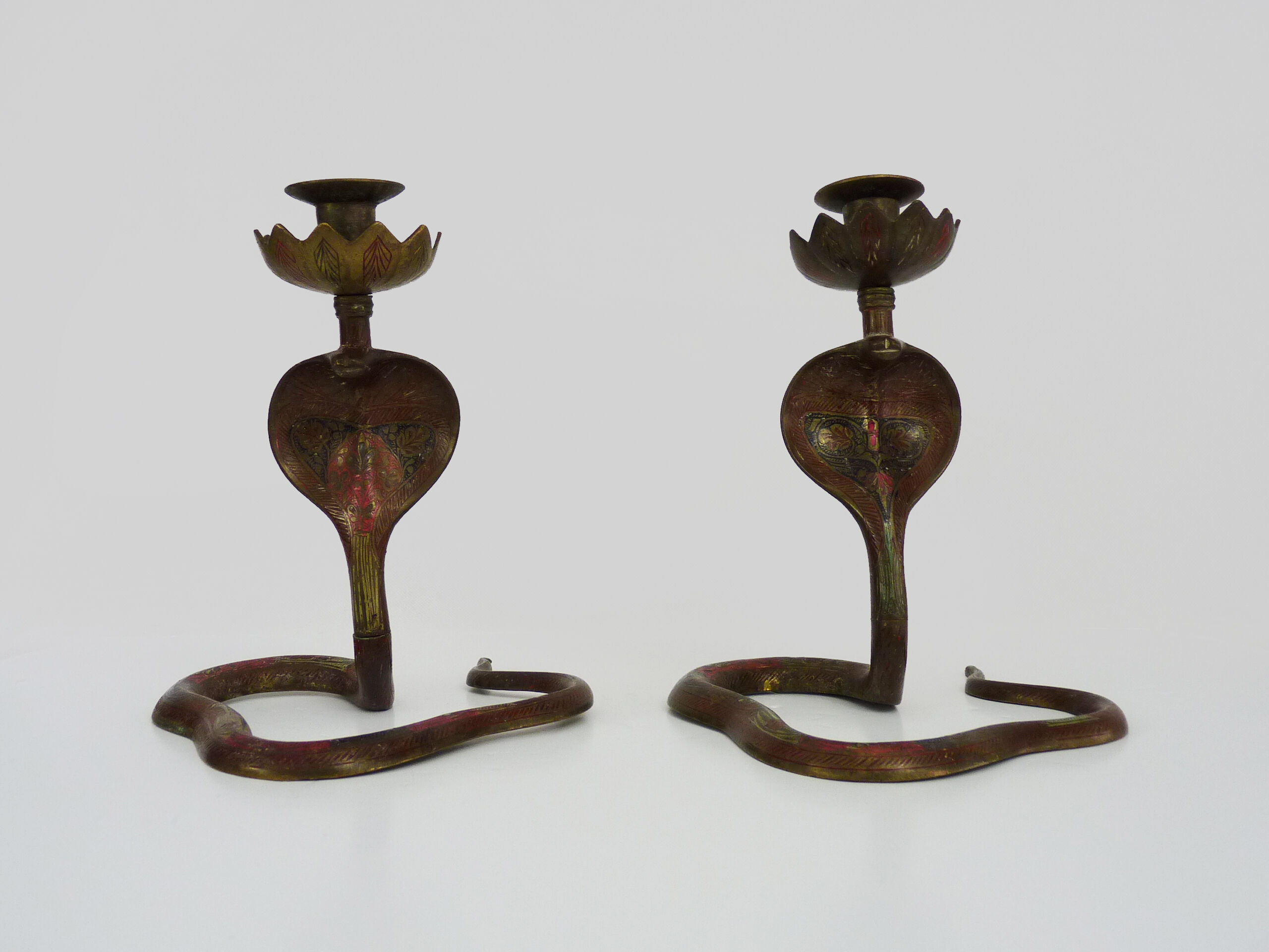 Pair of old bronze cobra candle holders with detailed engraving. Around 1950