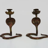 Pair of old bronze cobra candle holders with detailed engraving. Around 1950