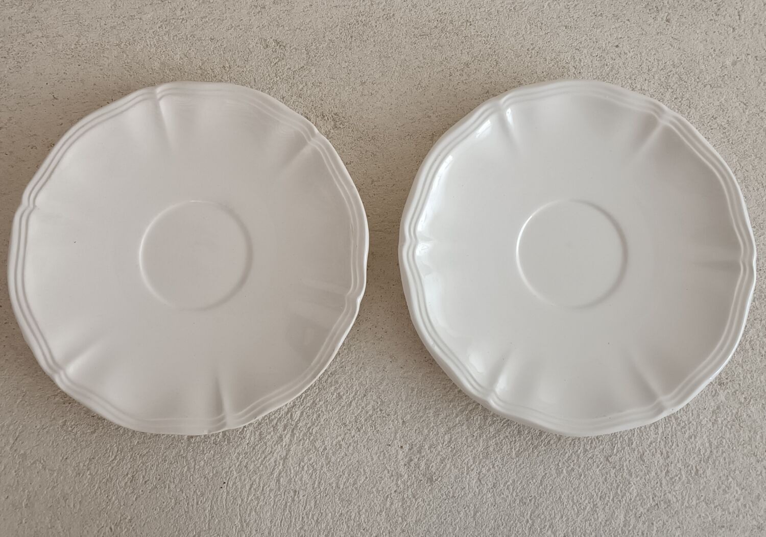 Two ivory cups and saucers from Sarreguemines