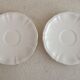 Two ivory cups and saucers from Sarreguemines