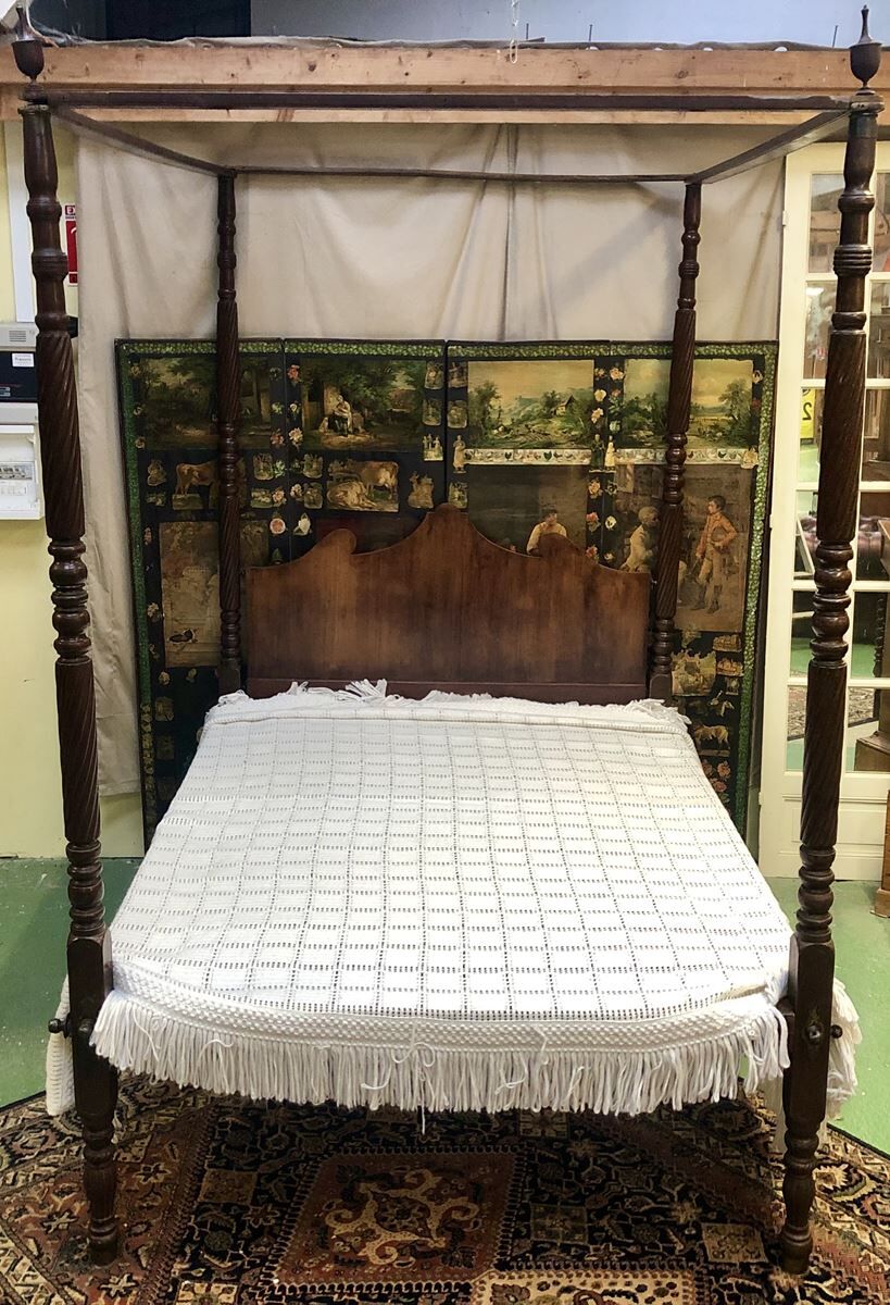 Four-poster bed in late 19th century mahogany