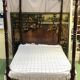 Four-poster bed in late 19th century mahogany