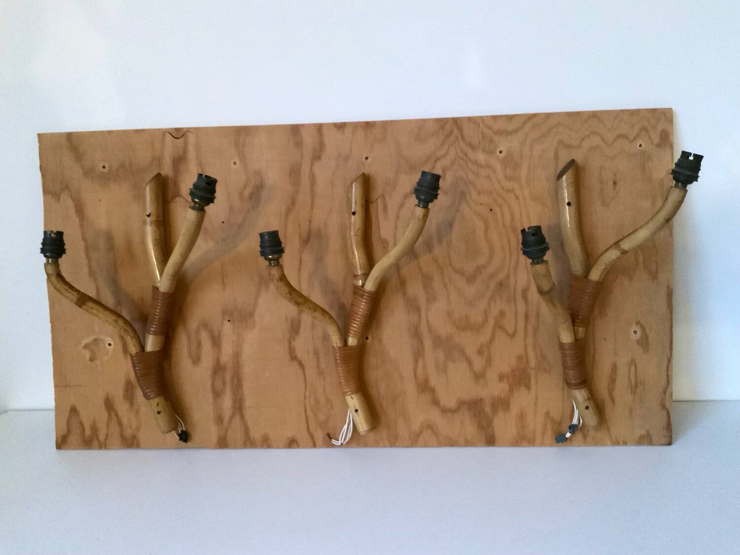 Rattan wall light trio