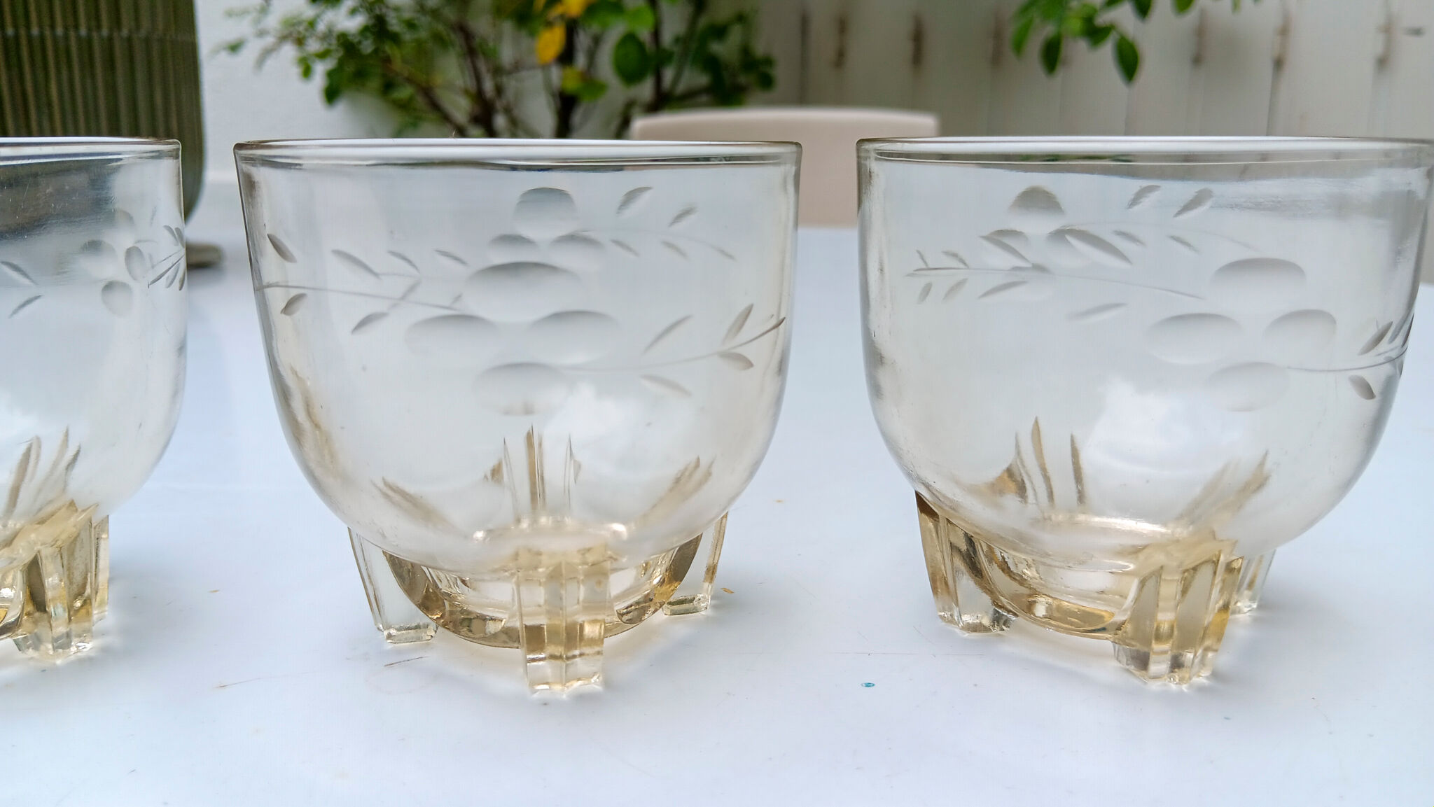3 low glasses on Art Deco stand