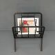 Black painted metal magazine holder