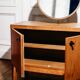 Vintage oak cabinet with circular mirror, 1960s modernist design.