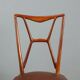 1950s chairs with wooden backs.
