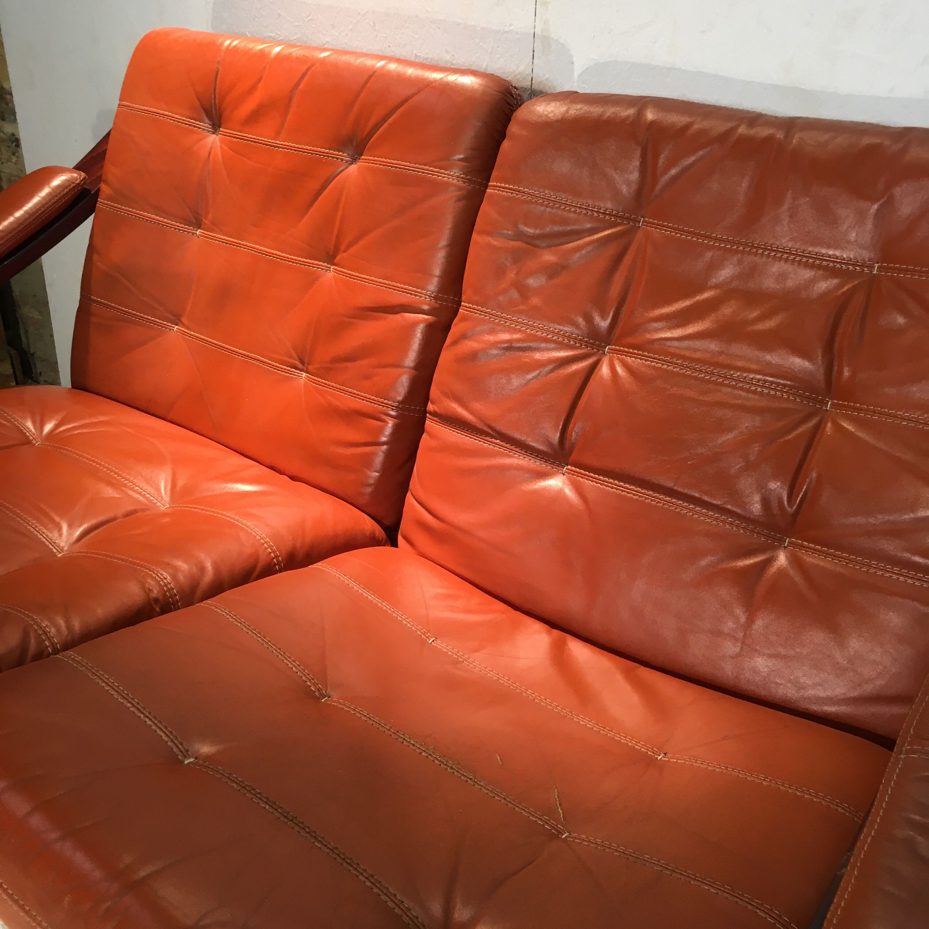 Wooden and ochre leather sofa