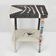 Table topped with a ceramic mosaic featuring an abstract design.