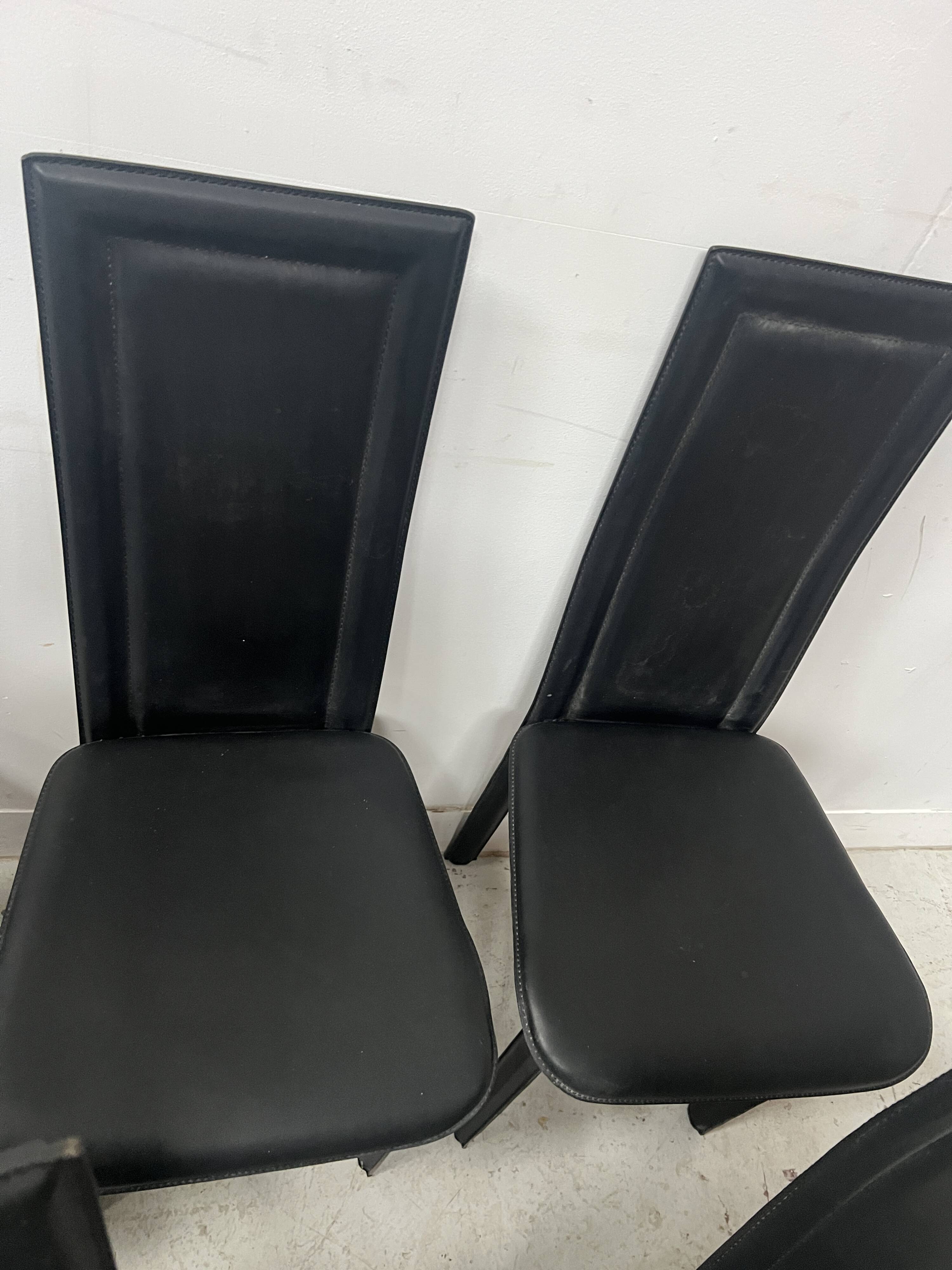 Set of eight designer chairs in black leather from the 20th century