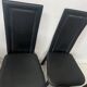 Set of eight designer chairs in black leather from the 20th century