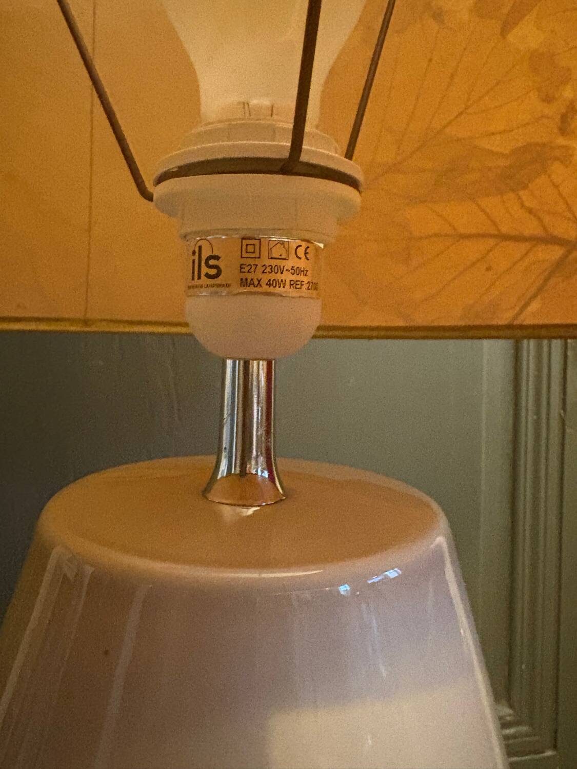 Large beige ceramic table lamp with a vintage shade.