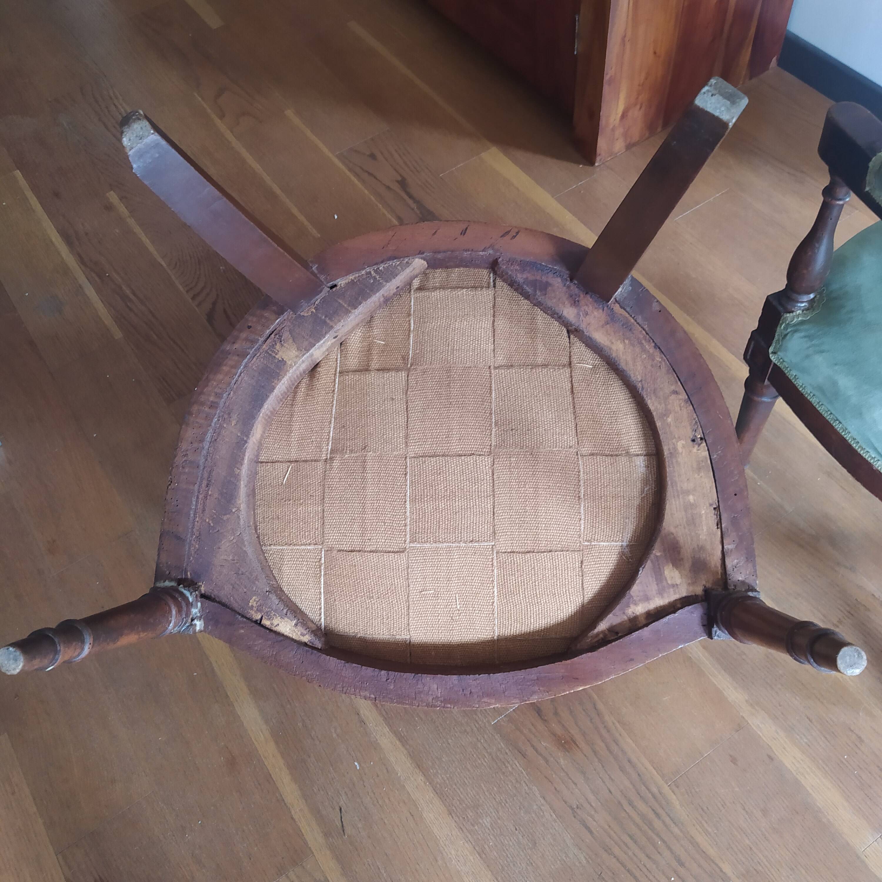 pair of Directoire armchairs in walnut, early 19th century, green velvet