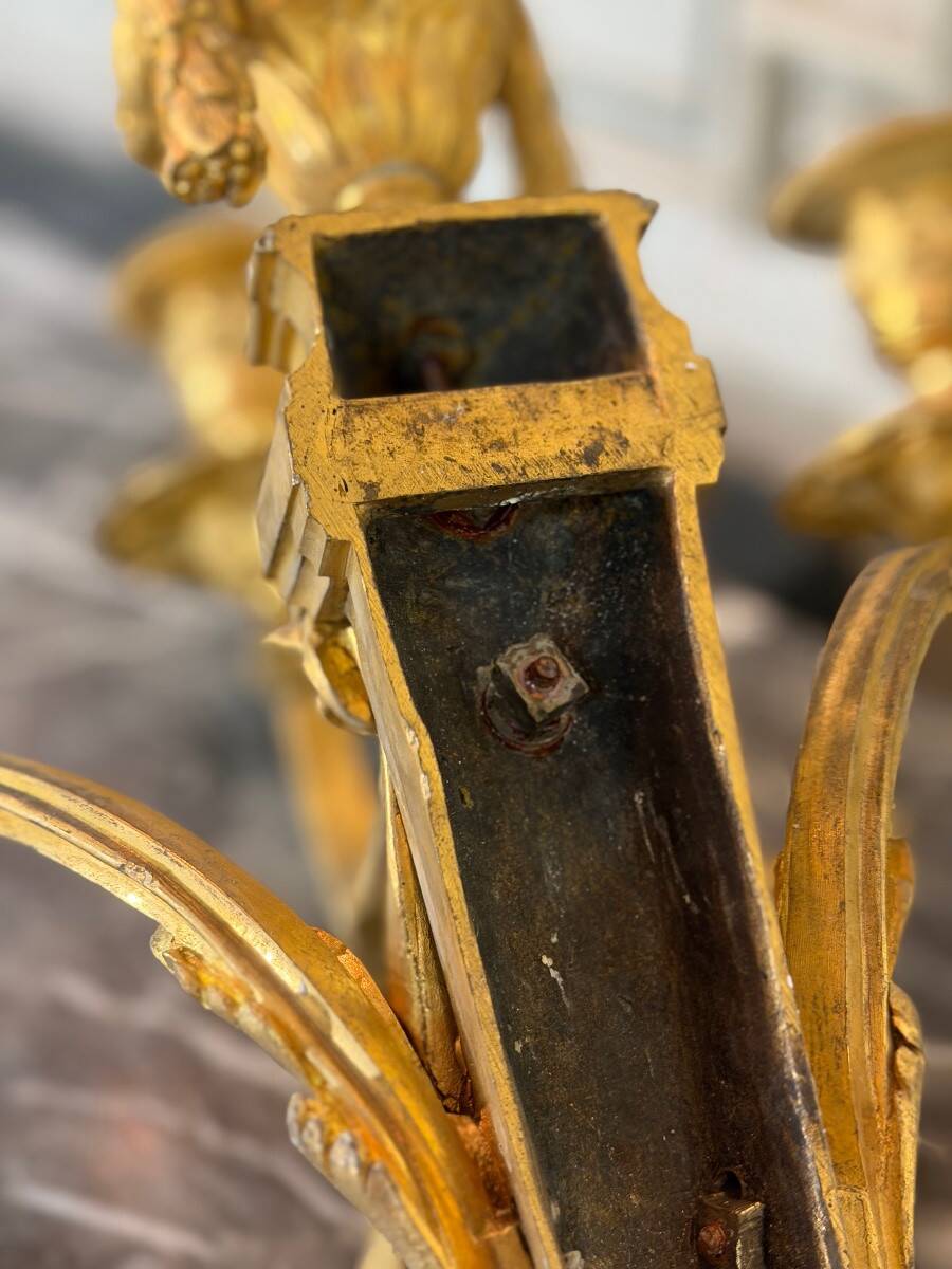 Pair of Louis XVI style wall sconces in gilded bronze, circa 1880.