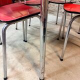 4 red Formica chairs with a 1970s table