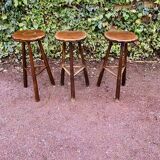 Set of three brutalist tripod stools