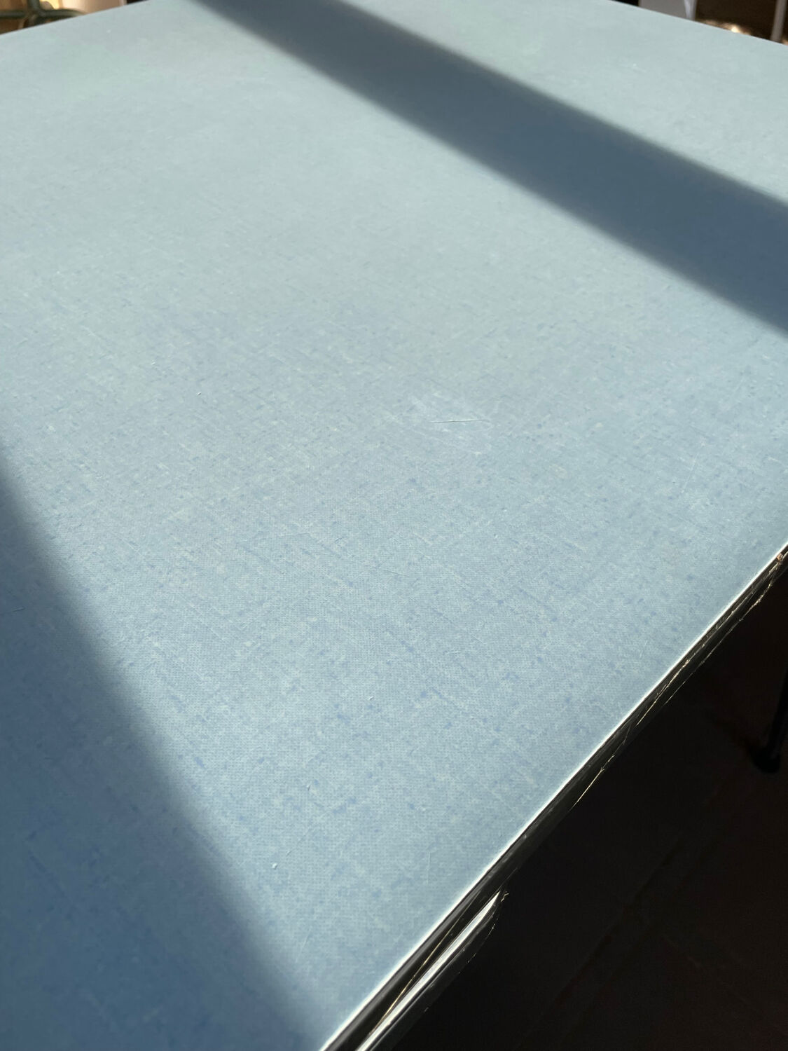 Blue Formica table for 4 to 6 people