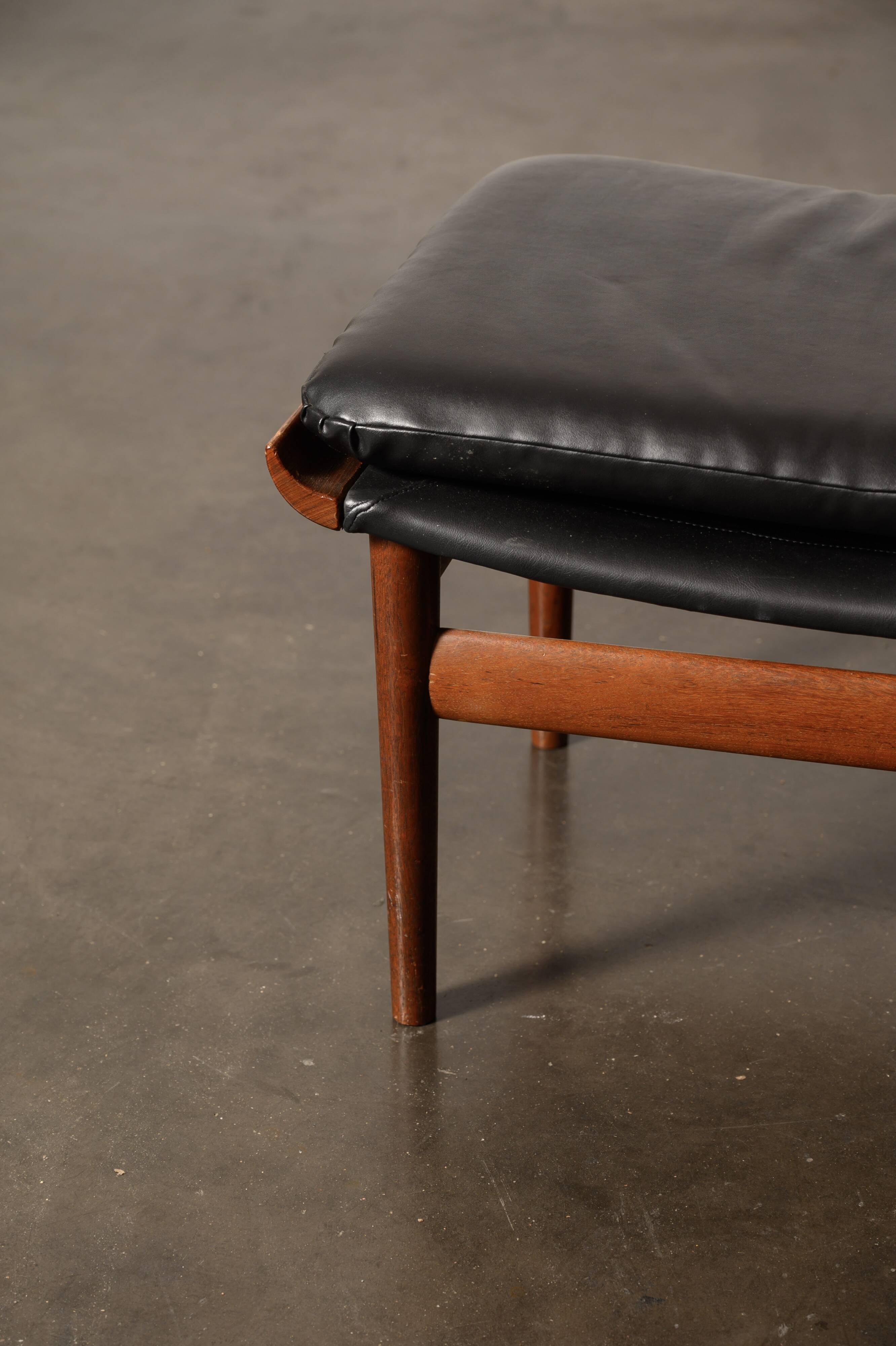 Finished Juhl armchair and its ottoman.