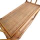 Bamboo and wicker bookshelf, vintage boho-chic from the '70s.