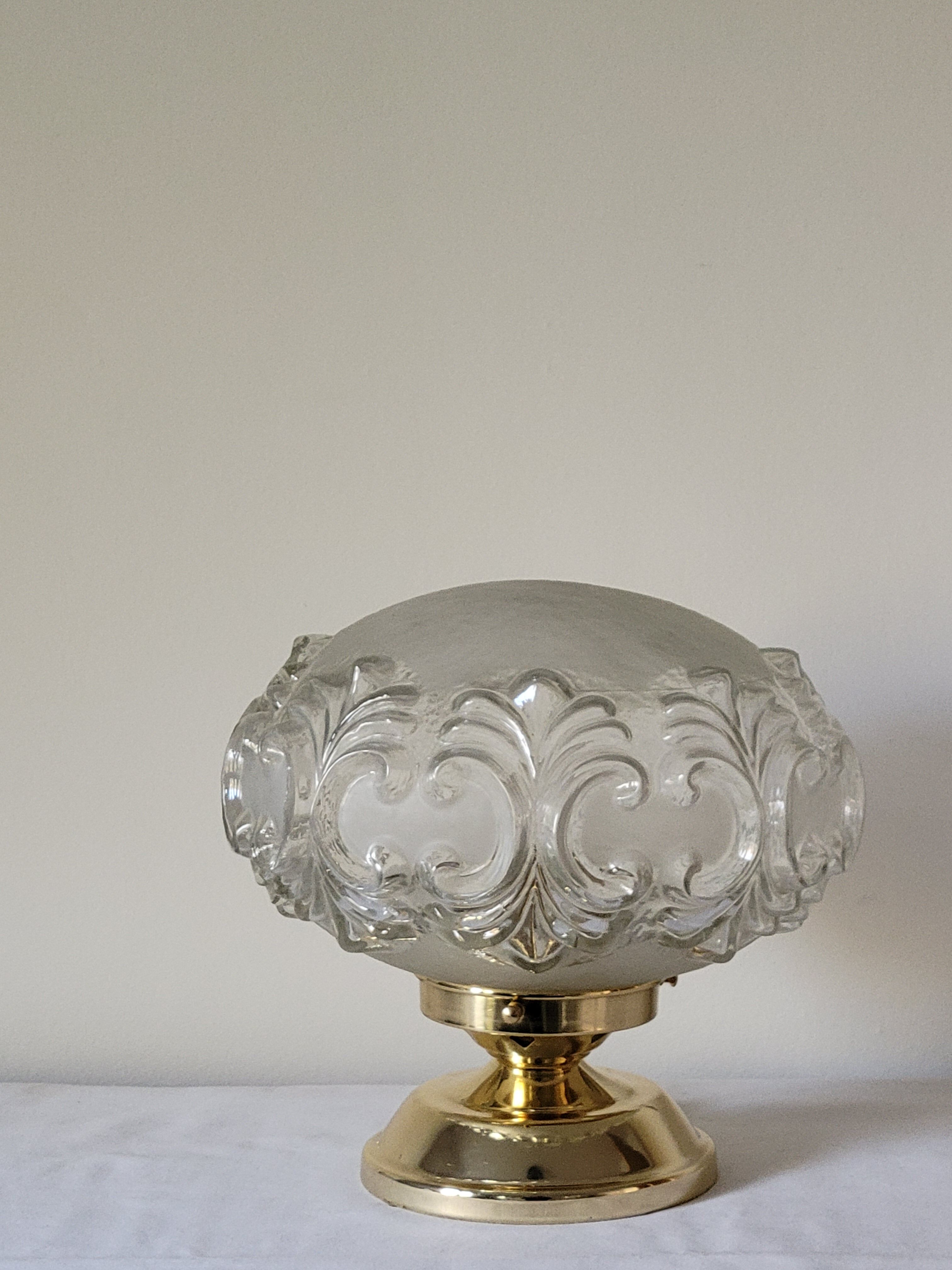 Brass lamp with molded glass globe