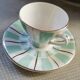 Digoin cup and saucer in green-striped Sarguemines