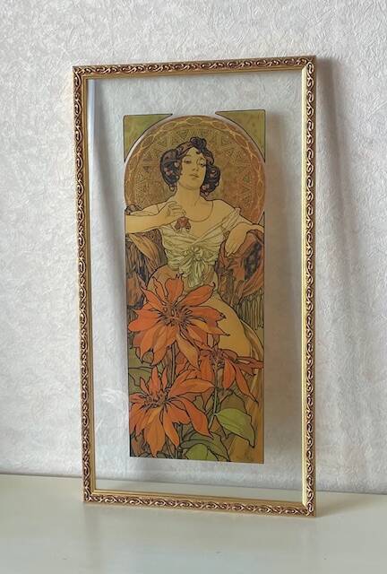 Mucha illustration on glass in a gilded frame