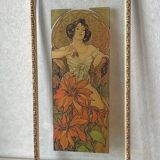 Mucha illustration on glass in a gilded frame