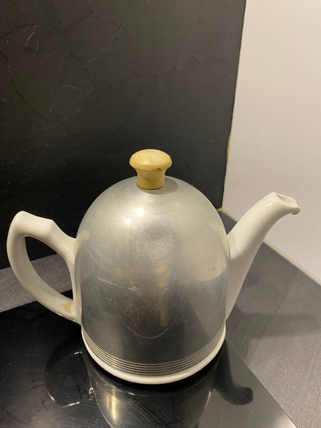 Nomar porcelain and steel teapot