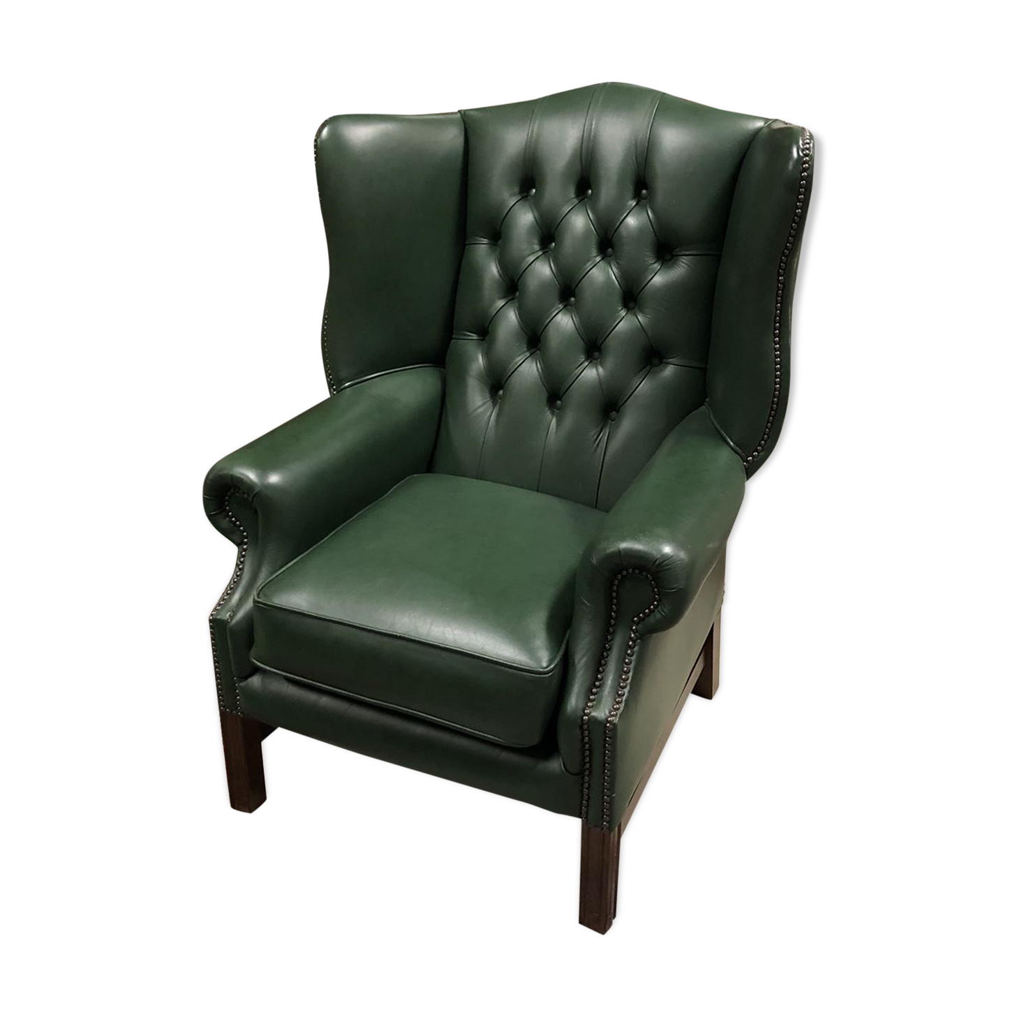 In the 1970s green leather Chesterfield armchair
