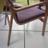 Relaxing armchair and its Scandinavian footrest