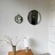 Brutalist round mirror with wrought iron and studs.